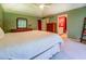 Spacious main bedroom featuring a white bed, dresser, and ensuite bath at 2903 Southpark Sw Ter, Conyers, GA 30094