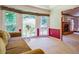 Comfortable sitting area with large windows offering scenic views, adjacent to the living room at 2903 Southpark Sw Ter, Conyers, GA 30094