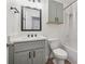 Bathroom features a gray vanity, black hardware, and a shower with a curtain at 76 Hollis Cir, Dallas, GA 30157