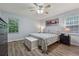 Bedroom offers natural light and hardwood flooring at 76 Hollis Cir, Dallas, GA 30157