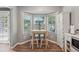 Inviting breakfast nook features a bright bay window and charming furniture perfect for casual dining at 76 Hollis Cir, Dallas, GA 30157