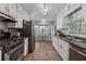 Well-equipped kitchen features stainless steel appliances, ample cabinetry, and adjacent breakfast nook at 76 Hollis Cir, Dallas, GA 30157