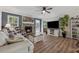 Inviting living room features a cozy stone fireplace and hardwood flooring at 76 Hollis Cir, Dallas, GA 30157