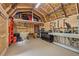 Interior of a fully-equipped workshop with an assortment of tools and ample workbench space for DIY projects at 76 Hollis Cir, Dallas, GA 30157