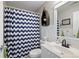 Bathroom featuring a vanity, toilet, and a blue chevron shower curtain at 105 Thorncliff Way, Acworth, GA 30101