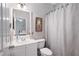 Bright bathroom with white vanity, patterned shower curtain, and neutral wall color at 105 Thorncliff Way, Acworth, GA 30101
