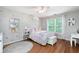 Charming bedroom features hardwood floors, a ceiling fan and whimsical decor at 105 Thorncliff Way, Acworth, GA 30101