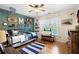 bedroom with hardwood floors, a ceiling fan, and natural light at 105 Thorncliff Way, Acworth, GA 30101