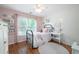 Cozy bedroom with hardwood floors, a large window and natural light at 105 Thorncliff Way, Acworth, GA 30101