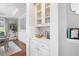 Elegant dining room with white cabinets and a view of the dining room through the doorway at 105 Thorncliff Way, Acworth, GA 30101