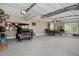 Oversized garage featuring a golf cart and boat for the outdoor enthusiast at 105 Thorncliff Way, Acworth, GA 30101