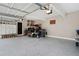 Spacious garage with ample storage, epoxy floors, and room for multiple vehicles at 105 Thorncliff Way, Acworth, GA 30101