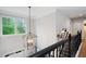 Hallway features large windows, a modern light fixture, and wall decor at 105 Thorncliff Way, Acworth, GA 30101