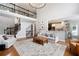 Inviting living room flows into the kitchen, offering a relaxed gathering space with hardwood floors and stylish decor at 105 Thorncliff Way, Acworth, GA 30101