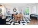 Bright playroom with large windows, a reading nook, and a playful atmosphere with chalkboard paint and wall decor at 105 Thorncliff Way, Acworth, GA 30101