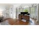 Bright workstation featuring a modern desk, monitors, and large windows at 105 Thorncliff Way, Acworth, GA 30101