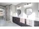 Bathroom featuring double vanities, modern fixtures, and a view of the outdoors at 170 Paislee Park (Lot #8 Paislee Park) Dr, Fayetteville, GA 30215