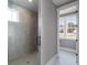 Modern bathroom with a glass-enclosed shower, neutral tile, and ample natural light at 170 Paislee Park (Lot #8 Paislee Park) Dr, Fayetteville, GA 30215