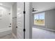 Bright bathroom featuring a modern tub-shower combination with tile surround and a window at 170 Paislee Park (Lot #8 Paislee Park) Dr, Fayetteville, GA 30215
