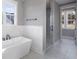 Bright bathroom with modern tub, separate shower, and large windows bringing in lots of light at 170 Paislee Park (Lot #8 Paislee Park) Dr, Fayetteville, GA 30215