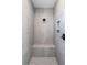 Elegant gray tiled shower featuring a built-in bench and convenient niche at 170 Paislee Park (Lot #8 Paislee Park) Dr, Fayetteville, GA 30215