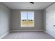 Bright bedroom with a large window overlooking the property and a neutral carpet at 170 Paislee Park (Lot #8 Paislee Park) Dr, Fayetteville, GA 30215