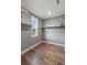A well-organized walk-in closet with hardwood floors, shelving, and a bright window at 170 Paislee Park (Lot #8 Paislee Park) Dr, Fayetteville, GA 30215