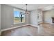 Dining area with hardwood floors, chandelier, and a view of the backyard with abundant natural light at 170 Paislee Park (Lot #8 Paislee Park) Dr, Fayetteville, GA 30215