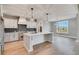 Modern kitchen featuring white cabinetry, granite countertops, and an island with bar seating at 170 Paislee Park (Lot #8 Paislee Park) Dr, Fayetteville, GA 30215
