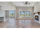 Bright living room features hardwood floors, a fireplace, and access to the outdoor patio at 170 Paislee Park (Lot #8 Paislee Park) Dr, Fayetteville, GA 30215