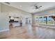 Bright open living space featuring a modern ceiling fan, hardwood floors and large windows for ample natural light at 170 Paislee Park (Lot #8 Paislee Park) Dr, Fayetteville, GA 30215