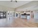 Open-concept living space with hardwood floors connects the kitchen, dining, and living area seamlessly at 170 Paislee Park (Lot #8 Paislee Park) Dr, Fayetteville, GA 30215