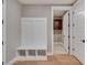 Mudroom with a built-in bench and storage, connecting to laundry room at 170 Paislee Park (Lot #8 Paislee Park) Dr, Fayetteville, GA 30215