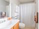 Standard bathroom featuring a tile floor, light wood vanity, and shower-tub combo at 176 Darbys Crossing Ct, Hiram, GA 30141