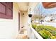 Inviting front porch adorned with lush plants and a hanging flower basket for added curb appeal at 176 Darbys Crossing Ct, Hiram, GA 30141