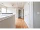 Bright hallway with wood floors, storage closets, and neutral walls create a welcoming space at 176 Darbys Crossing Ct, Hiram, GA 30141