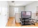 Bright hallway with wood floors, storage closets, and neutral walls create a welcoming space at 176 Darbys Crossing Ct, Hiram, GA 30141