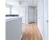 Bright hallway with wood floors, storage closets, and neutral walls create a welcoming space at 176 Darbys Crossing Ct, Hiram, GA 30141