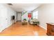 Spacious living room featuring hardwood floors, comfortable seating, and ample room for entertaining at 176 Darbys Crossing Ct, Hiram, GA 30141