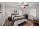 Serene bedroom features a queen size bed, neutral walls, hardwood floors, and natural lighting at 1941 Headland Dr, East Point, GA 30344