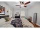 Cozy bedroom with a ceiling fan, complemented by neutral tones and natural window light at 1941 Headland Dr, East Point, GA 30344