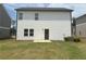 Exterior rear view with a well-maintained lawn at 2093 Boxwood Se Cir, Conyers, GA 30094