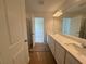 Bathroom boasts a double sink vanity with ample counter space and bright lighting at 2093 Boxwood Se Cir, Conyers, GA 30094