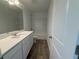 Bathroom featuring a white vanity, large mirror, and a tub-shower combination at 2093 Boxwood Se Cir, Conyers, GA 30094