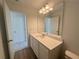 Bathroom showcasing a white vanity with a large mirror and bright lighting at 2093 Boxwood Se Cir, Conyers, GA 30094