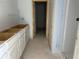 Bathroom featuring new white cabinets, awaiting sinks, countertop, and plumbing installations in an unfinished space at 2093 Boxwood Se Cir, Conyers, GA 30094