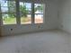 Well-lit bedroom with large windows and a view of the backyard, offering a serene retreat awaiting flooring at 2093 Boxwood Se Cir, Conyers, GA 30094