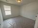 Bedroom with natural light highlighting the neutral walls and spacious layout at 2093 Boxwood Se Cir, Conyers, GA 30094