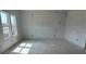 Bright bedroom with large windows, offering natural light and views, awaiting personalization and finishing touches at 2093 Boxwood Se Cir, Conyers, GA 30094