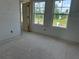 Bedroom with two bright windows overlooking a pond, ready to be completed with flooring and personal touches at 2093 Boxwood Se Cir, Conyers, GA 30094